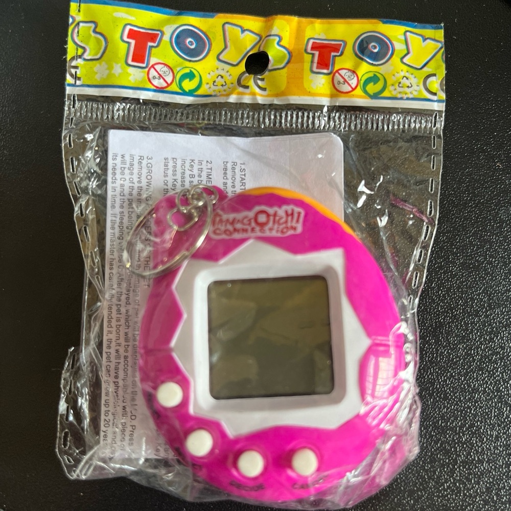 Tamagotchi Connection Electronic Retro 90’s Virtual Cyber Pet Toy Game Keychain